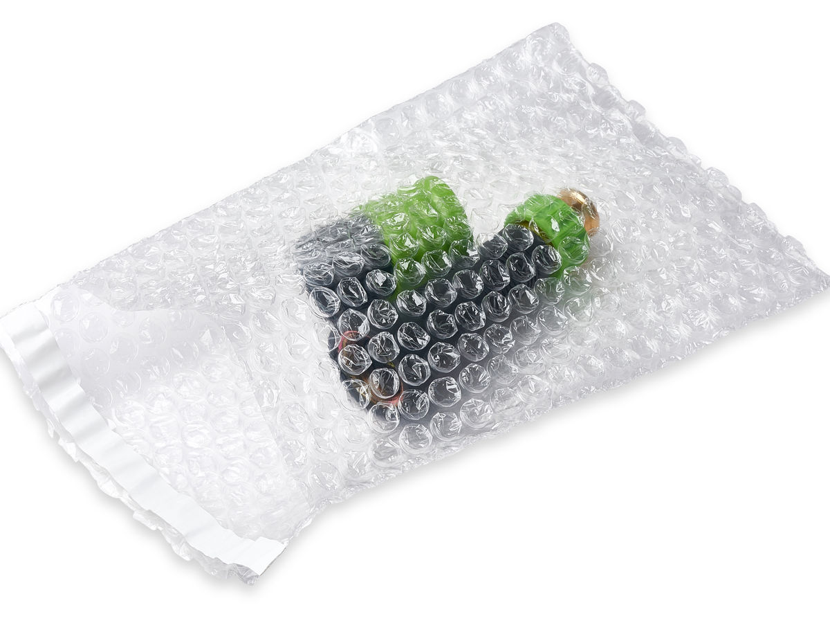 Clear self-seal bubble pouch wrapping a small fragile item