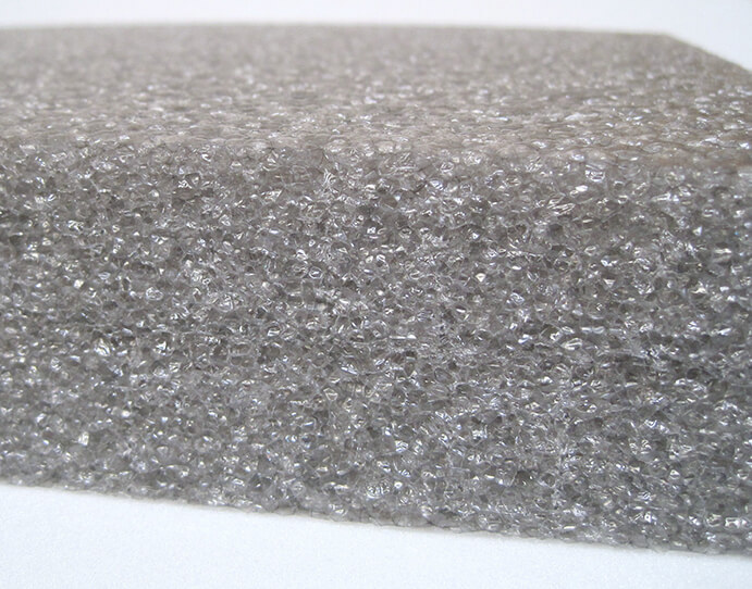 Grey reticulated open-cell foam edge