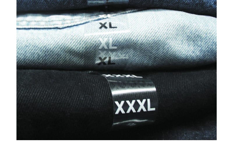 Folded jeans with printed size labels — L, XL, XXXL