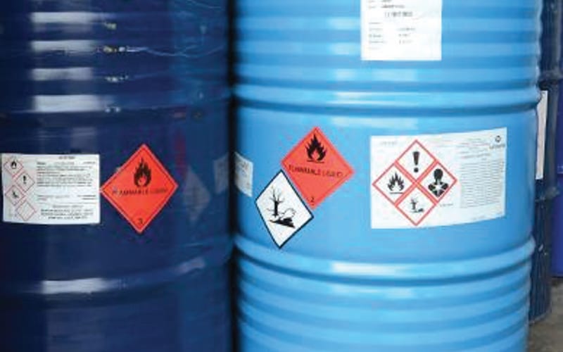 GHS hazard labels on chemical drums and containers