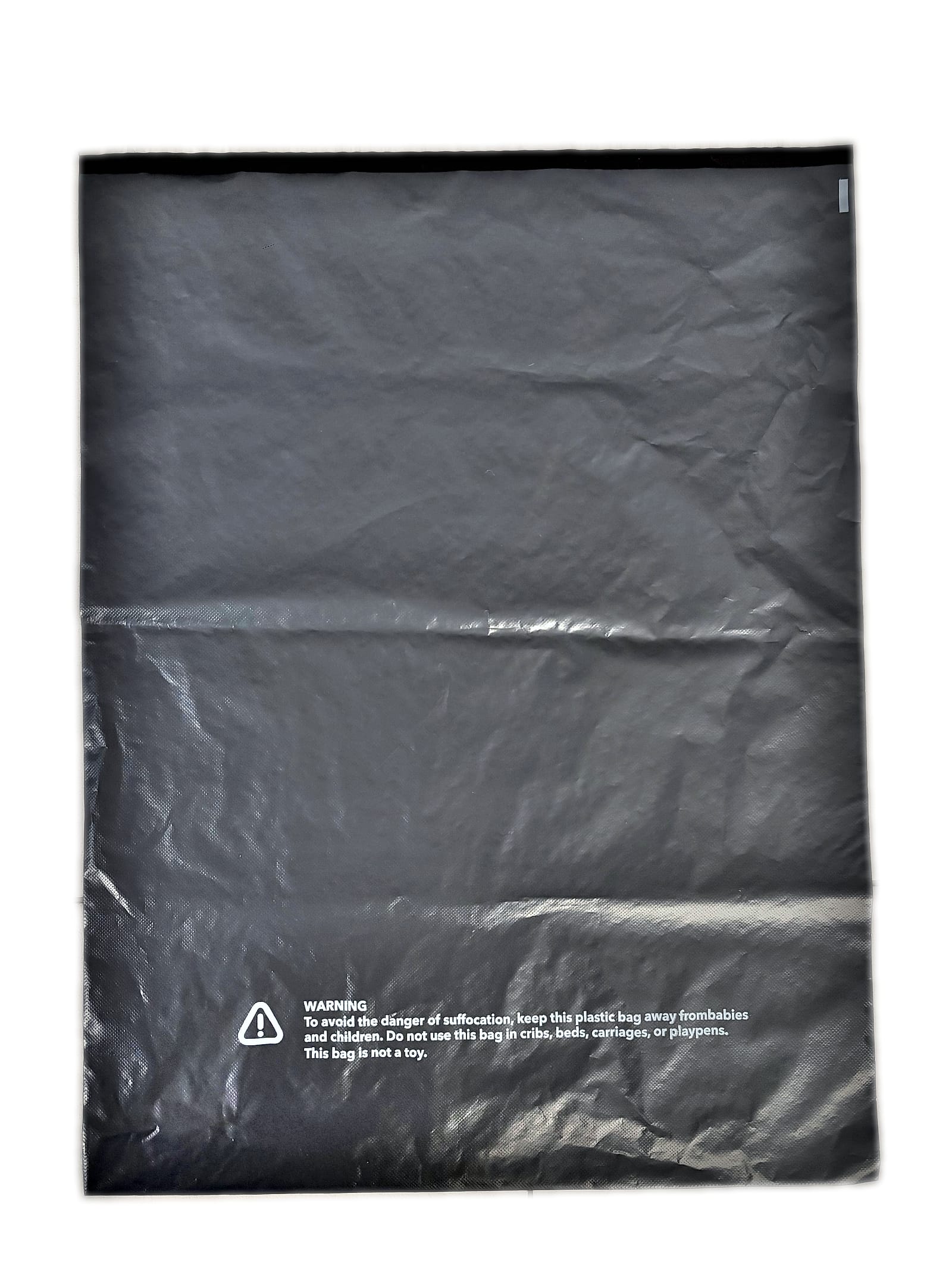Back face of the mailer showing the seal flap with its liner and the printed suffocation warning panel