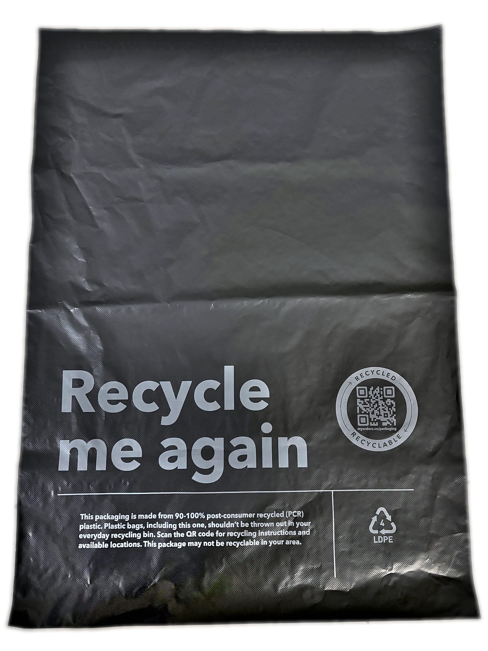 The finished textured mailer, front face, showing the embossed film and the customer's printed recycling panel