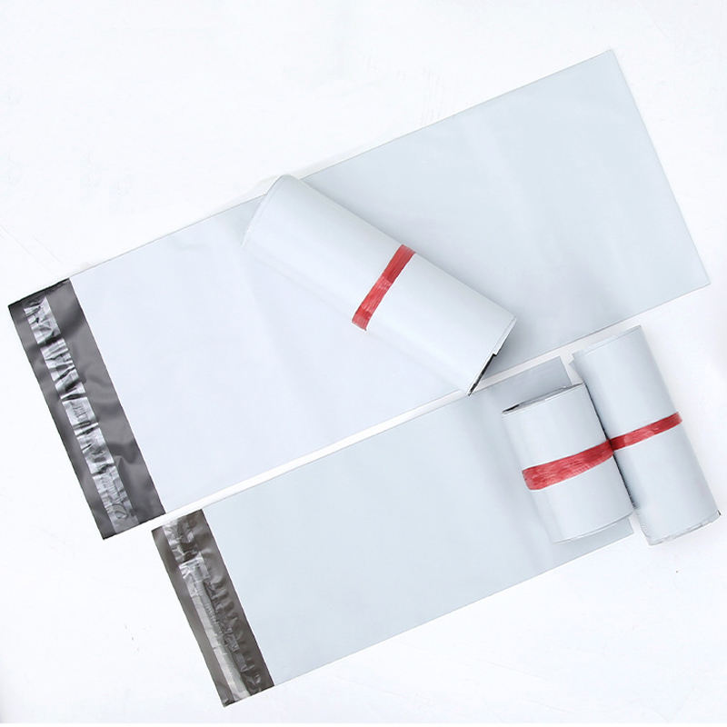 Rolls of poly mailer film in the plant — the recycled construction runs through the same extrusion, print and converting line as the virgin film