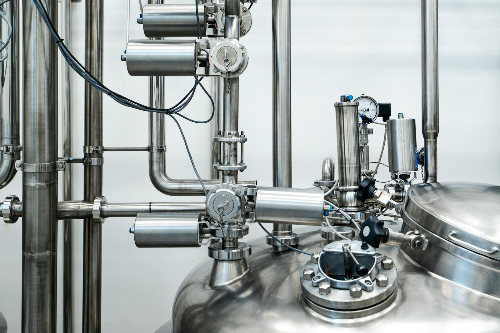Poly film extrusion line with an operator at the gauge monitor — where film thickness is set and measured